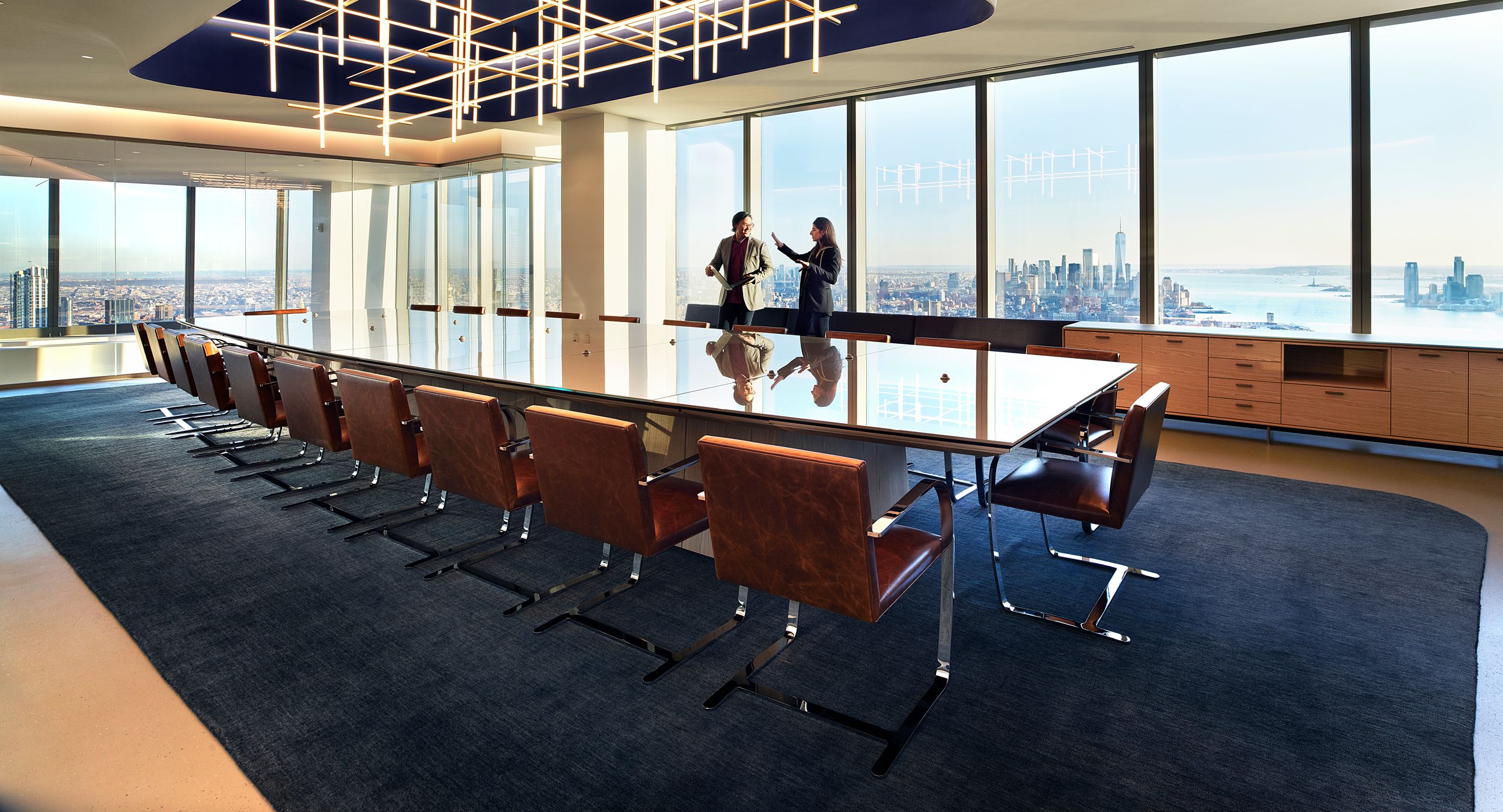 Stunning MESA table with etched glass surface and HALO storage with integrated gallery seating form the centerpiece of this amazing space.